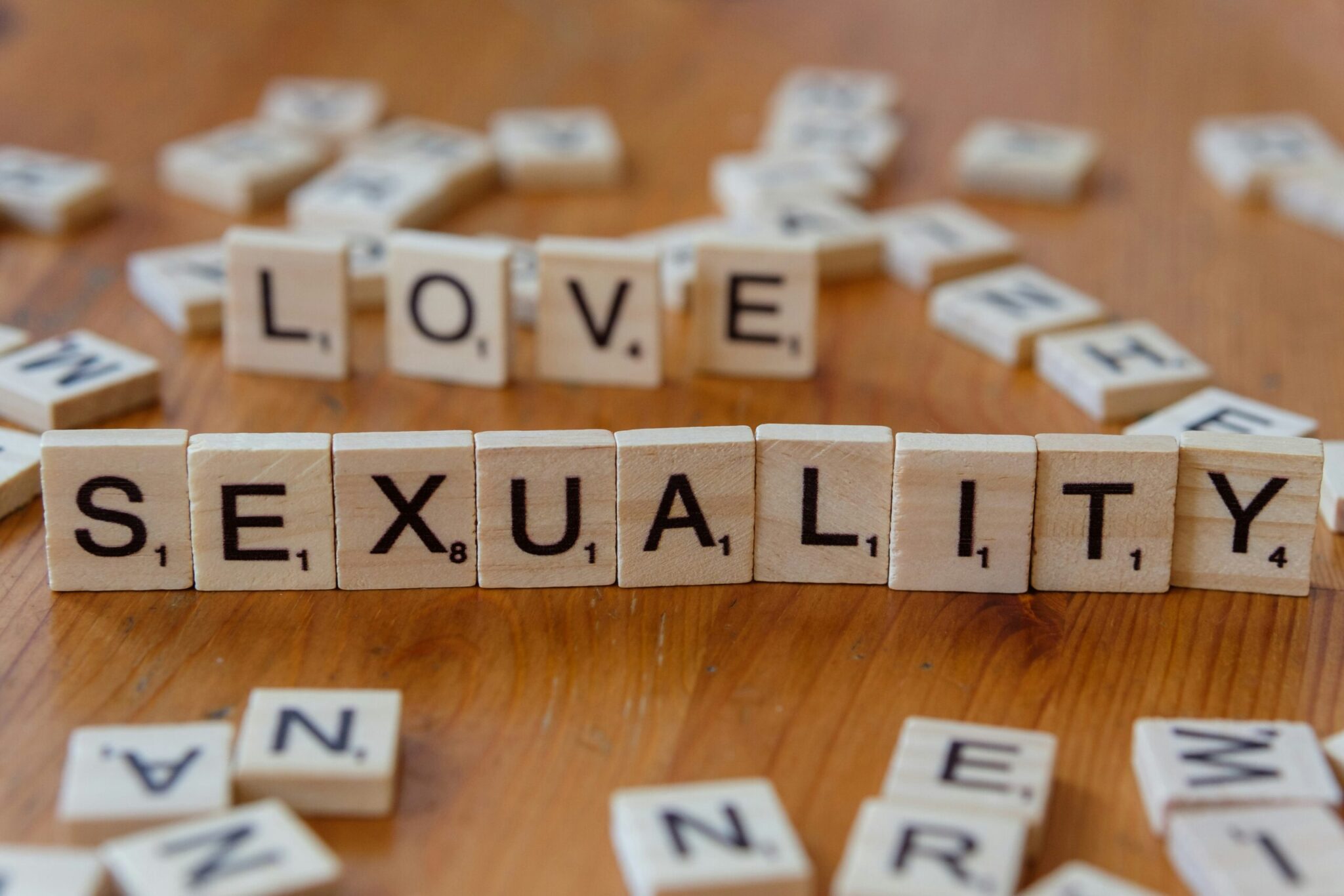 Tiles spelling sexuality representing inclusive and responsible sexual education